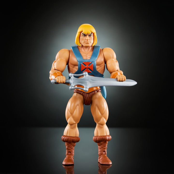 Jucărie Masters of the Universe Origins, He-Man figurină de acțiune din colecția de desene animate, la scară reală, aprox. 14 cm înălțime, erou cu armură, 2 săbii și mini benzi desenate, HYD17