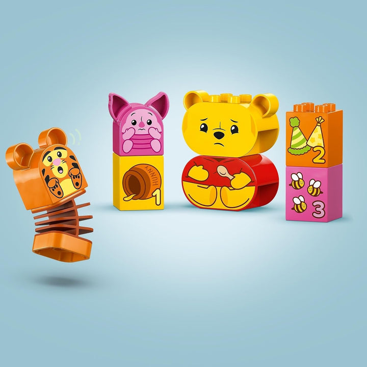 LEGO DUPLO - Disney Winnie the Pooh's Birthday Party - jucărie educativă pentru preșcolari - set cu 3 minifigurine, inclusiv Winnie the Pooh, Tigger și Piglet - idee de cadou pentru băieți și fete de la 1,5 ani 10457